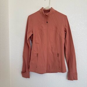 Women's terra cotta colored Lululemon zip-up Jacket